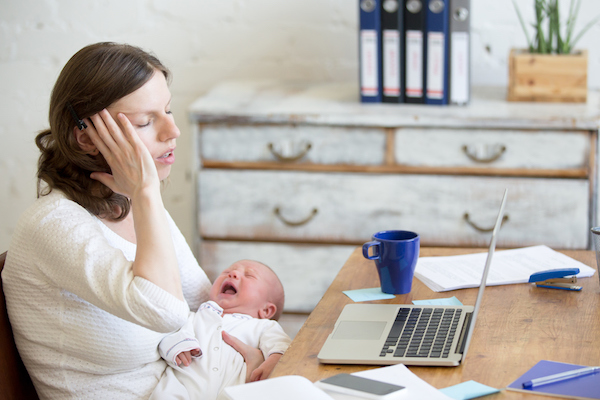 new mother holding infant